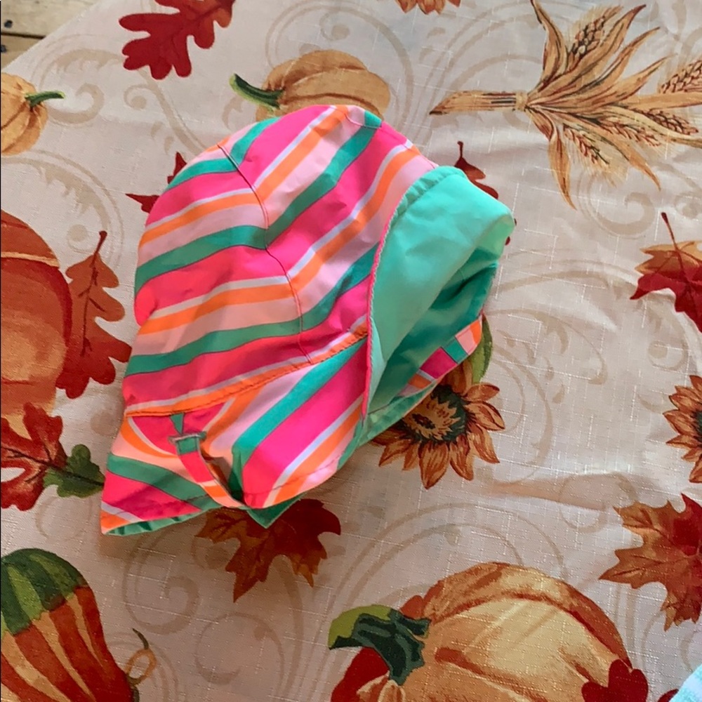 Reversible summer infant hat with neck strap